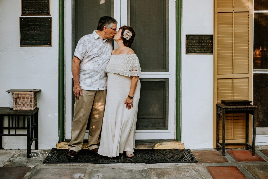 Couple poses at Ernest Hemmingway House in Key West